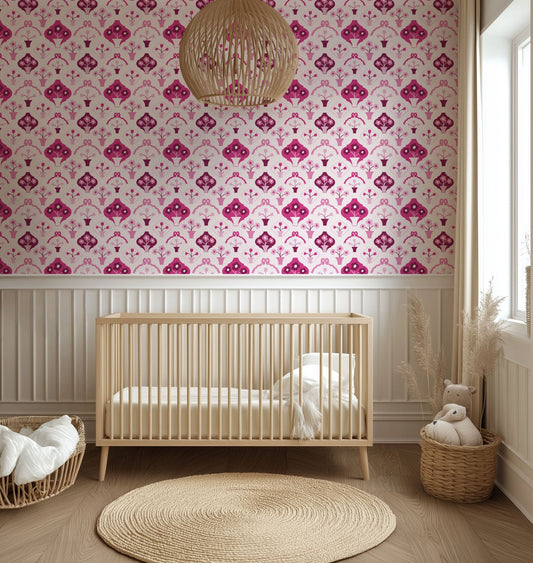 Mockup of wallpaper design featuring pink flower pots and bows in a baby nursery.