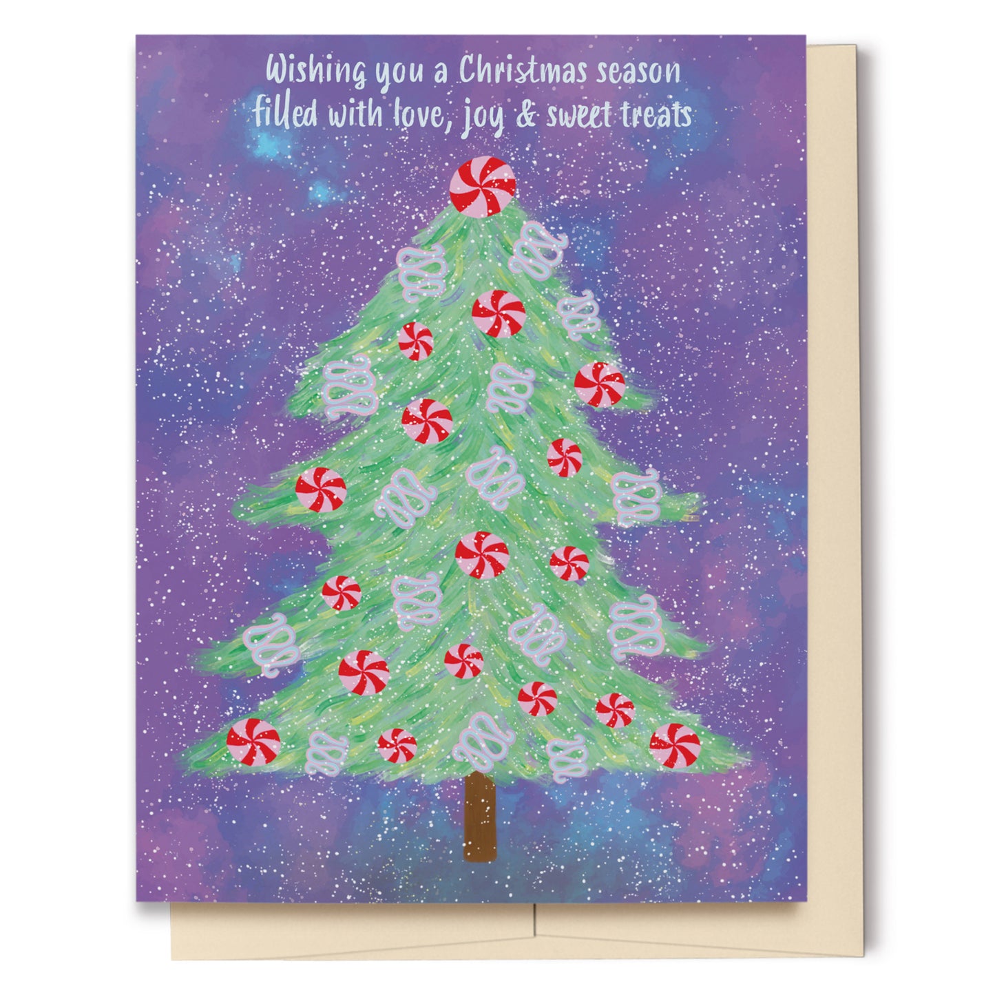 Greeting card featuring a hand drawn Christmas tree decorated with candy on a galaxy-like background. Text reads, Wishing you a Christmas season filled with love, joy and sweet treats.