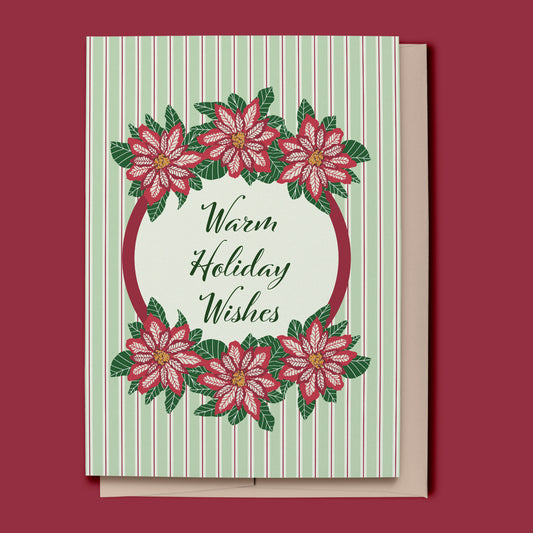 Greeting card with poinsettia design and 'Warm Holiday Wishes' text on a striped background.