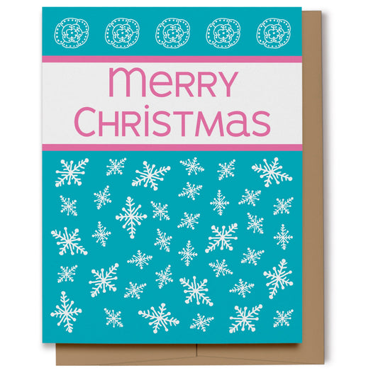 Merry Christmas card with white snowflakes on a turquoise blue background with pink text.