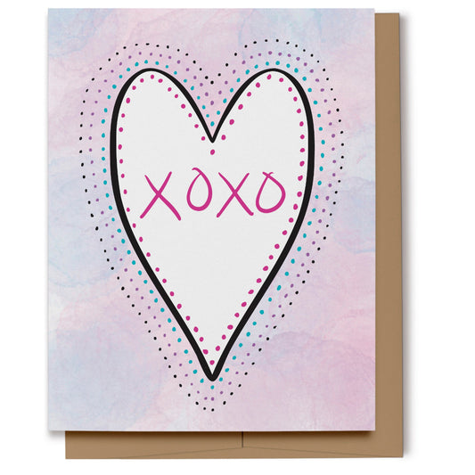 Love card featuring a white heart with hand lettered XOXO outlined with polka dots on a pink, purple and blue watercolor background.