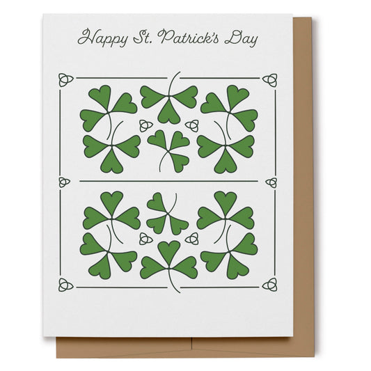 Happy St. Patrick's Day card with digitally hand drawn green shamrocks and trinity knots with script text which reads, "Happy St. Patrick's Day".