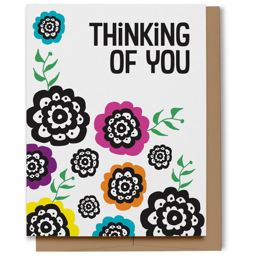 Thinking of you card with bright and colorful flowers in pink, blue, orange, purple, yellow and black with text which reads, "Thinking of You".